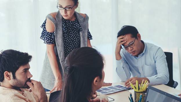 A group of people in a meeting

AI-generated content may be incorrect.